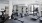 Fitness center with attached yoga and spin rooms and large windows.