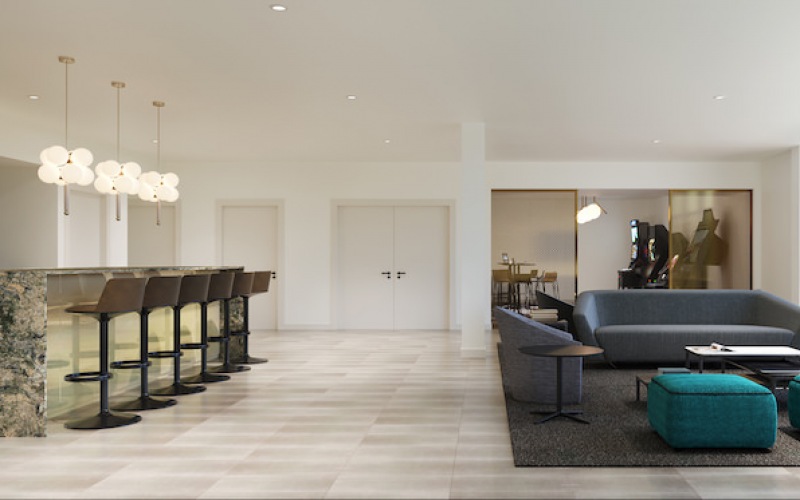 Spacious lounge with large windows and plenty of seating 