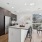 Kitchen with a huge island and barstools for entertaining.